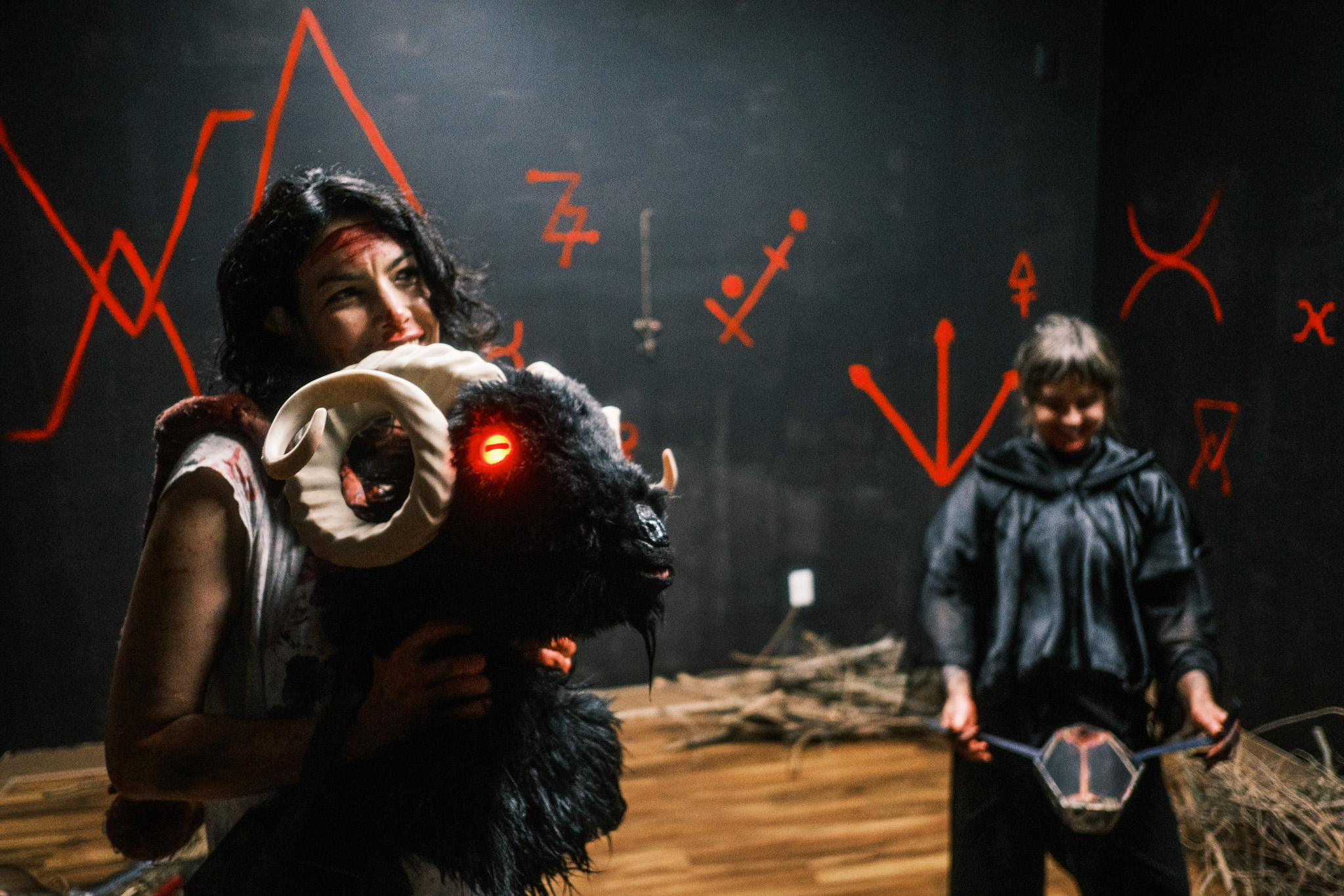 Actor holds goat head